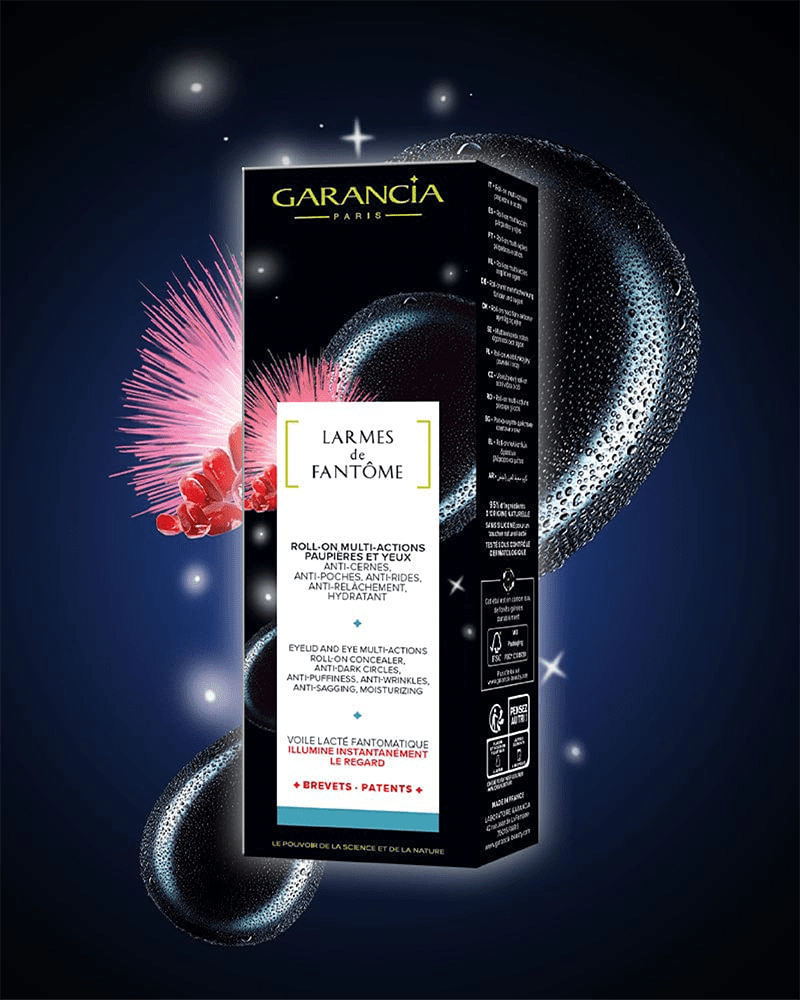 Packaging du soin contour des yeux Garancia Larmes de Fantôme : Roll-on multi-actions anti-cernes et anti-poches sur fond de nuit étoilée