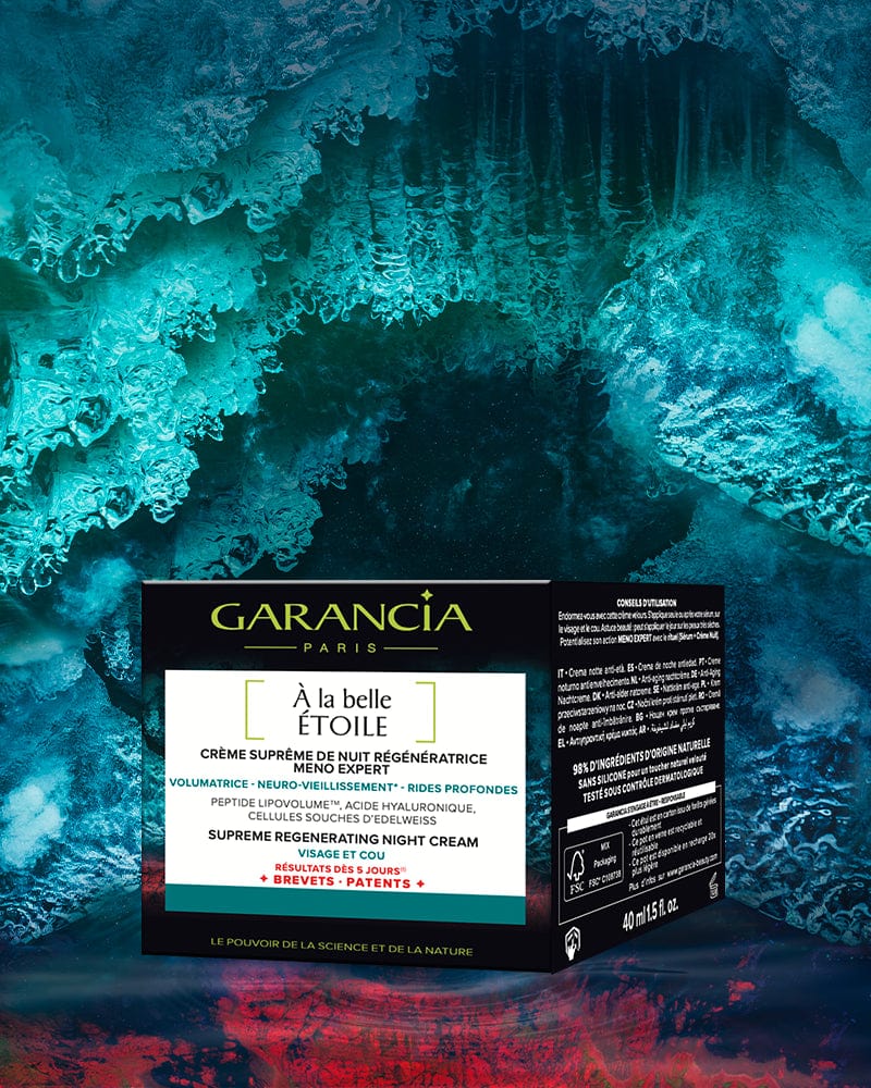 Laboratoire Garancia Packaging de la crème de nuit Garancia À la belle Étoile (Meno-Expert). Texte : Crème Suprême de Nuit Régénératrice, 98% d'ingrédients d'origine naturelle, résultats dès 5 jours. Présenté sur un fond de glace bleu turquoise.