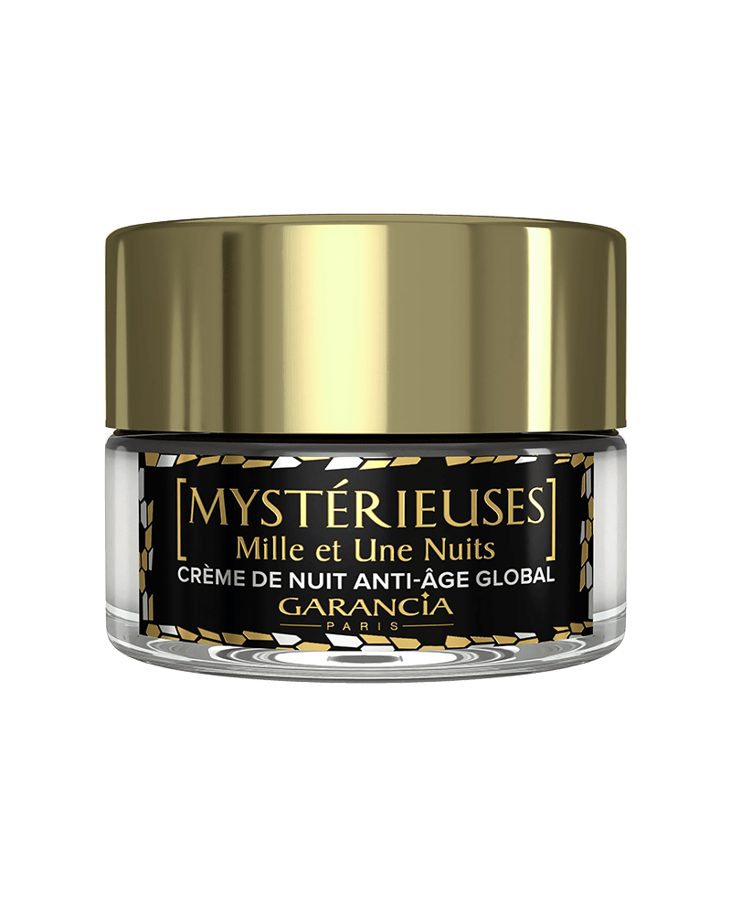 Fond transparent Laboratoire Garancia : Pot de crème de nuit anti-âge global Mystérieuses Mille et Une Nuits de Garancia. Packaging élégant noir et or avec un capot doré brillant.