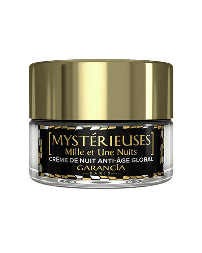 Fond transparent Laboratoire Garancia : Pot de crème de nuit anti-âge global Mystérieuses Mille et Une Nuits de Garancia. Packaging élégant noir et or avec un capot doré brillant.