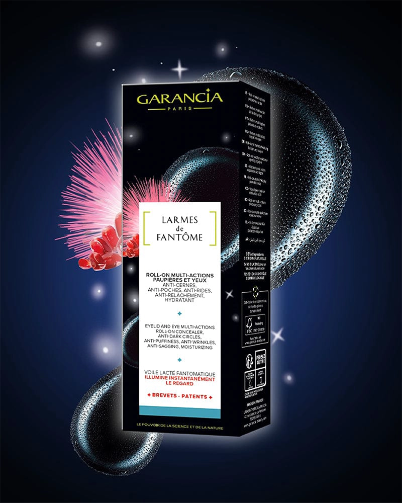 Packaging du soin contour des yeux Garancia Larmes de Fantôme : Roll-on multi-actions anti-cernes et anti-poches sur fond de nuit étoilée